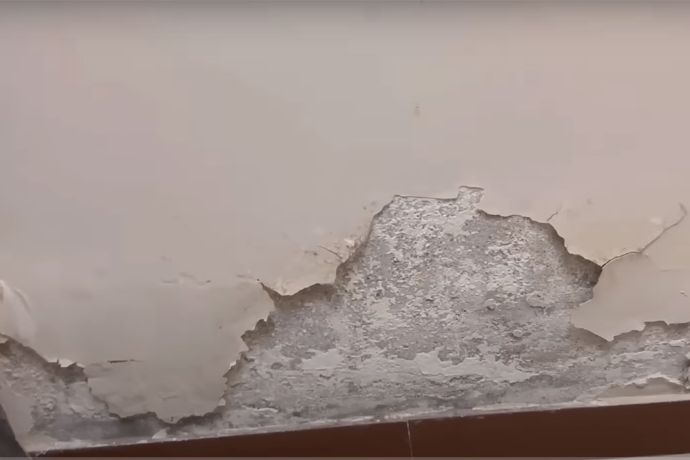 Salt damp causing paint on a wall to peel