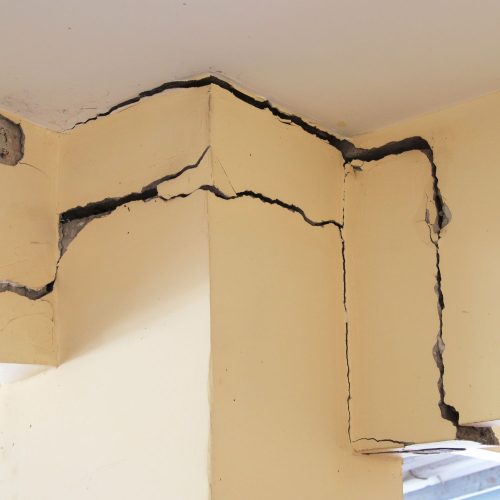 Cracks on a building wall that need stitching