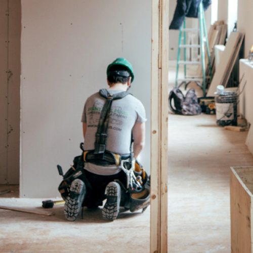 A builder performing renovations on a home interior